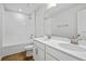 Bathroom with a double vanity, tub, and tile flooring at 1416 Maddie Berry Ln, Kissimmee, FL 34744