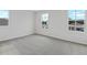 Spacious bedroom with plush carpeting and multiple windows at 1416 Maddie Berry Ln, Kissimmee, FL 34744
