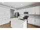 Modern kitchen with stainless steel appliances and white cabinets at 1416 Maddie Berry Ln, Kissimmee, FL 34744