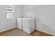 Laundry room with washer, dryer, and overhead shelving at 1416 Maddie Berry Ln, Kissimmee, FL 34744
