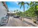 Large backyard with a private pool, patio, and lush landscaping, perfect for relaxing and entertaining in a tropical setting at 2891 Swoop Cir, Kissimmee, FL 34741
