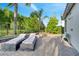 Serene backyard featuring lounge chairs on a paved patio, perfect for relaxation and enjoying the peaceful surroundings at 2891 Swoop Cir, Kissimmee, FL 34741