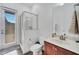 Bright bathroom featuring a walk-in shower with glass door at 2891 Swoop Cir, Kissimmee, FL 34741