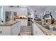 Well-lit kitchen featuring granite countertops, stainless steel appliances, and ample cabinet space at 2891 Swoop Cir, Kissimmee, FL 34741