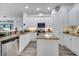 Bright, open kitchen with granite counters, stainless steel appliances, and ample storage at 2891 Swoop Cir, Kissimmee, FL 34741