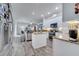 Spacious kitchen features granite countertops and stainless steel appliances with backyard view at 2891 Swoop Cir, Kissimmee, FL 34741