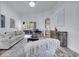 Bright living room with stylish furnishings, grand piano, and sliding glass doors to the outdoor space at 2891 Swoop Cir, Kissimmee, FL 34741