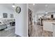 Open-concept living area seamlessly connects to the kitchen with sleek stainless steel appliances at 2891 Swoop Cir, Kissimmee, FL 34741