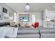 Comfortable living room with modern decor, stylish furniture, and a large flat-screen television at 2891 Swoop Cir, Kissimmee, FL 34741
