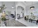 Inviting living space with neutral tones, archways, piano and plenty of space to relax and entertain at 2891 Swoop Cir, Kissimmee, FL 34741