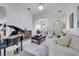 Spacious living area with marble floors, modern furnishings, and plenty of natural light at 2891 Swoop Cir, Kissimmee, FL 34741