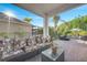 Comfortable covered patio with plush seating, offering a relaxing outdoor living space at 2891 Swoop Cir, Kissimmee, FL 34741
