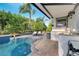 Enjoy the outdoor kitchen by the pool with a built-in sink and plenty of space for grilling and entertaining at 2891 Swoop Cir, Kissimmee, FL 34741