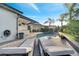 Beautiful backyard showcasing a private pool, lounge chairs, outdoor kitchen, and lush landscaping for serene outdoor living at 2891 Swoop Cir, Kissimmee, FL 34741