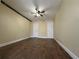 Neutral bedroom featuring wood-look tile flooring, ceiling fan, and two large closets at 5108 Conroy Rd # 1713, Orlando, FL 32811