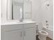 Clean bathroom with white vanity, bathtub, and tile shower at 883 Griffon Ave, Lake Alfred, FL 33850