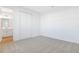 Bright bedroom with neutral carpeting and double-door closet at 883 Griffon Ave, Lake Alfred, FL 33850