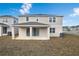 Two-story house with backyard patio at 883 Griffon Ave, Lake Alfred, FL 33850