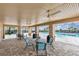 Covered patio area with tables near pool at 883 Griffon Ave, Lake Alfred, FL 33850