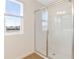 Clean shower with glass enclosure and bright white tiles at 883 Griffon Ave, Lake Alfred, FL 33850