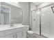 Modern bathroom with white vanity, sleek fixtures, and a glass-enclosed shower for a clean and bright look at 4220 Sawtooth Ct, Tavares, FL 32778