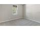 Cozy bedroom with plush carpeting, a window for natural light, and freshly painted walls at 4220 Sawtooth Ct, Tavares, FL 32778