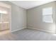 A spacious bedroom with carpeted floors and a connecting bathroom with double vanity at 4220 Sawtooth Ct, Tavares, FL 32778