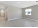 Bright, neutral living room showcasing tile floors, natural light from the window, and smooth walls at 4220 Sawtooth Ct, Tavares, FL 32778