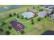Aerial view showcasing community pool, playground and landscaping, offering recreational opportunities at 2378 White Lilly Dr, Kissimmee, FL 34747