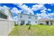 Large backyard with a well-maintained lawn, ready for outdoor activities and entertaining under the bright sky at 2378 White Lilly Dr, Kissimmee, FL 34747