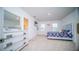 Bedroom with neutral carpet, en suite bathroom and ample natural light from a large window at 2378 White Lilly Dr, Kissimmee, FL 34747