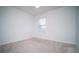 This carpeted bedroom is bright and airy with a window view at 2378 White Lilly Dr, Kissimmee, FL 34747