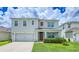 Charming two-story home with well-manicured lawn and attached two car garage at 2378 White Lilly Dr, Kissimmee, FL 34747