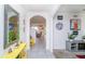 Bright and airy foyer with neutral tones, modern decor, and arched entryway into the living space at 2378 White Lilly Dr, Kissimmee, FL 34747