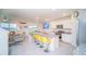 A modern kitchen with granite counters, stainless steel appliances, an island, and dining space at 2378 White Lilly Dr, Kissimmee, FL 34747