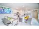 Modern eat-in kitchen with stainless steel appliances, an island with bar seating and granite countertops at 2378 White Lilly Dr, Kissimmee, FL 34747