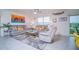 Comfortable living room featuring stylish decor, plush seating, and tile flooring at 2378 White Lilly Dr, Kissimmee, FL 34747