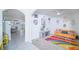 Bright open-concept living space, with unique decorations, connecting to the outdoors at 2378 White Lilly Dr, Kissimmee, FL 34747