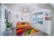 Cozy living room featuring a decorative wall, bright decor and large windows at 2378 White Lilly Dr, Kissimmee, FL 34747