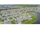 Panoramic aerial view of a meticulously planned neighborhood, complete with serene pond and manicured streets at 2378 White Lilly Dr, Kissimmee, FL 34747