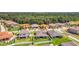 Aerial view of houses and neighborhood with green yards at 3875 Bowfin Trl, Kissimmee, FL 34746