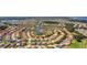 Aerial view of a large community with a lake and many houses at 3875 Bowfin Trl, Kissimmee, FL 34746