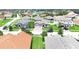 Aerial view of a community with houses, roads, and lush green spaces at 3875 Bowfin Trl, Kissimmee, FL 34746