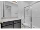 Bathroom with dark vanity, toilet, and large walk-in shower at 3875 Bowfin Trl, Kissimmee, FL 34746