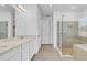 Modern bathroom with double vanity, walk in shower, and separate toilet area at 3875 Bowfin Trl, Kissimmee, FL 34746