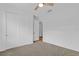 Well-lit bedroom featuring double closets and carpet flooring at 3875 Bowfin Trl, Kissimmee, FL 34746