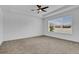 Large bedroom with neutral carpeting and ample space at 3875 Bowfin Trl, Kissimmee, FL 34746