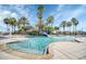 Relaxing community pool with water slide and palm trees at 3875 Bowfin Trl, Kissimmee, FL 34746