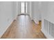 Bright entry hall with wood-look tile flooring and neutral walls at 3875 Bowfin Trl, Kissimmee, FL 34746