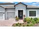 Inviting home exterior with gray siding and landscaping at 3875 Bowfin Trl, Kissimmee, FL 34746